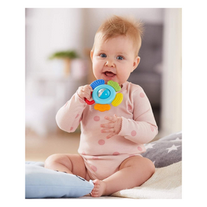 Baby playing with clutching toy