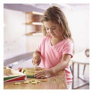 Child playing with pizza party play food