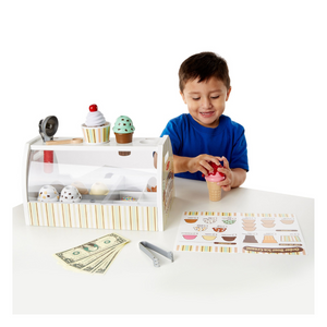 Child playing with ice cream counter