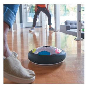 Kids playing with air power soccer disk