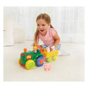 Child playing with tractor