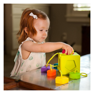 Child playing with Oombee Cube