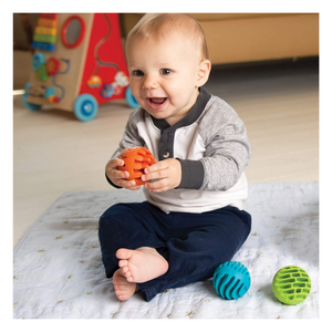 Baby playing with rollers